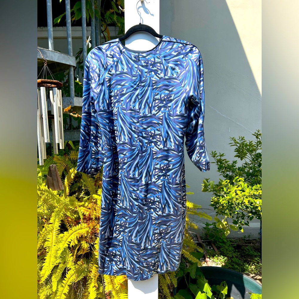 NWOT, lined silk knee length back zip dress. Never worn